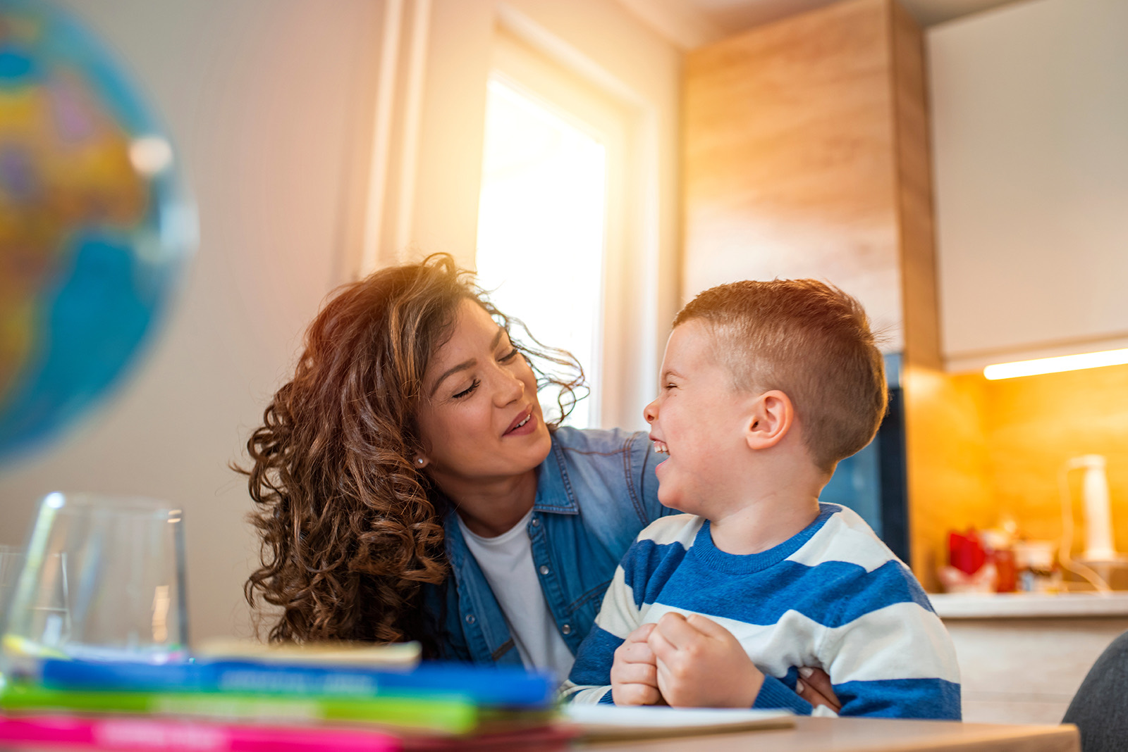 A caregiver and child playing together at home in Michigan
